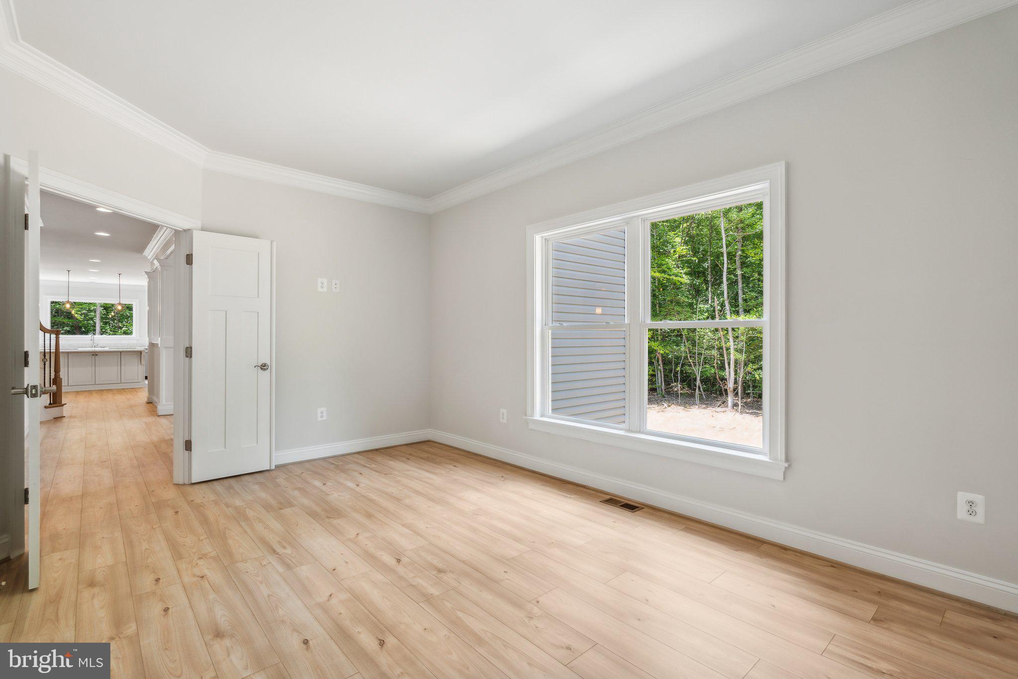 13749 Orlando Road Nokesville, VA 20181 - Photo 34 of 42 an empty room with wooden floor and windows