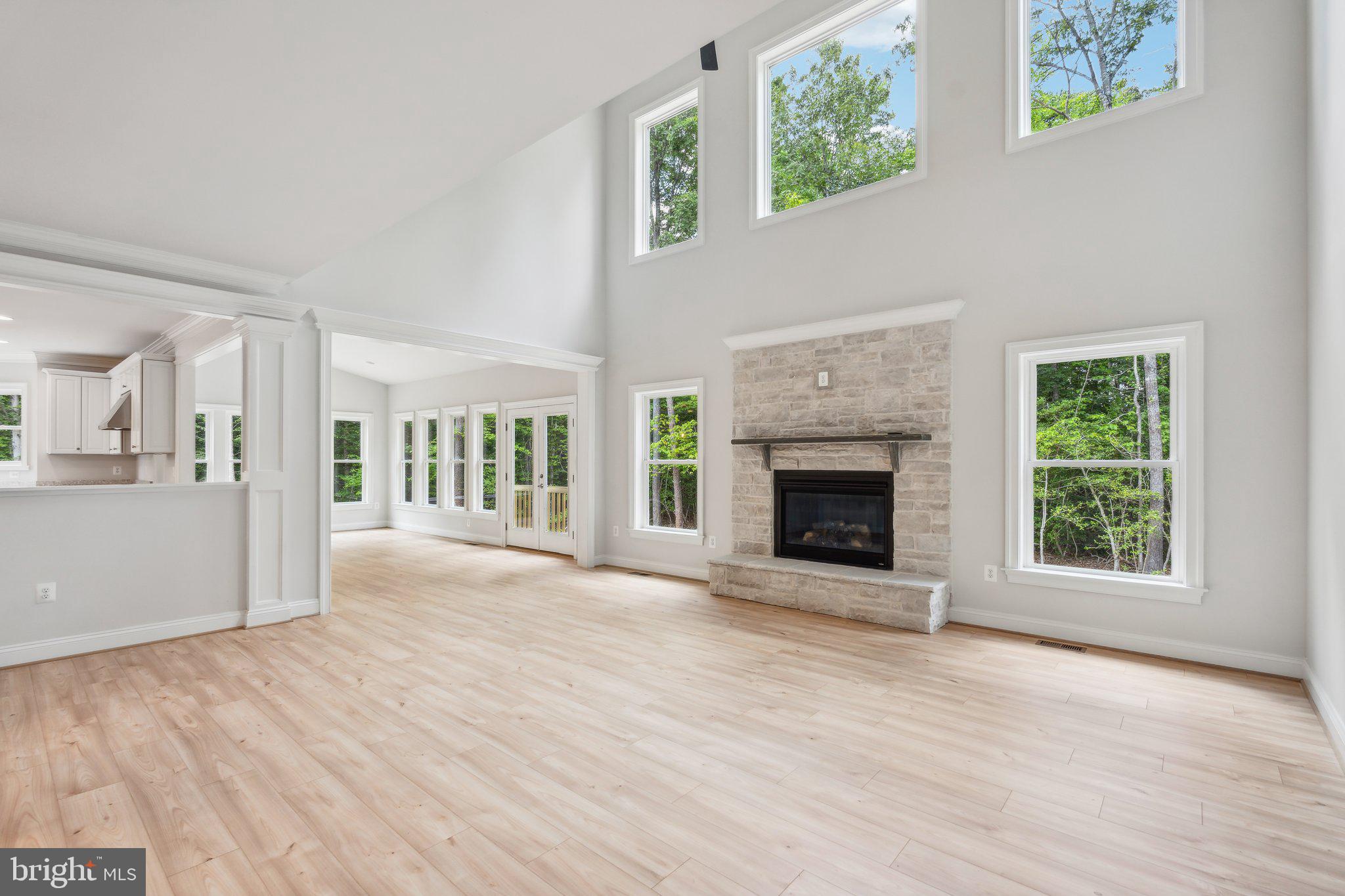 13749 Orlando Road Nokesville, VA 20181 - Photo 35 of 42 a view of an empty room with wooden floor fireplace and a window