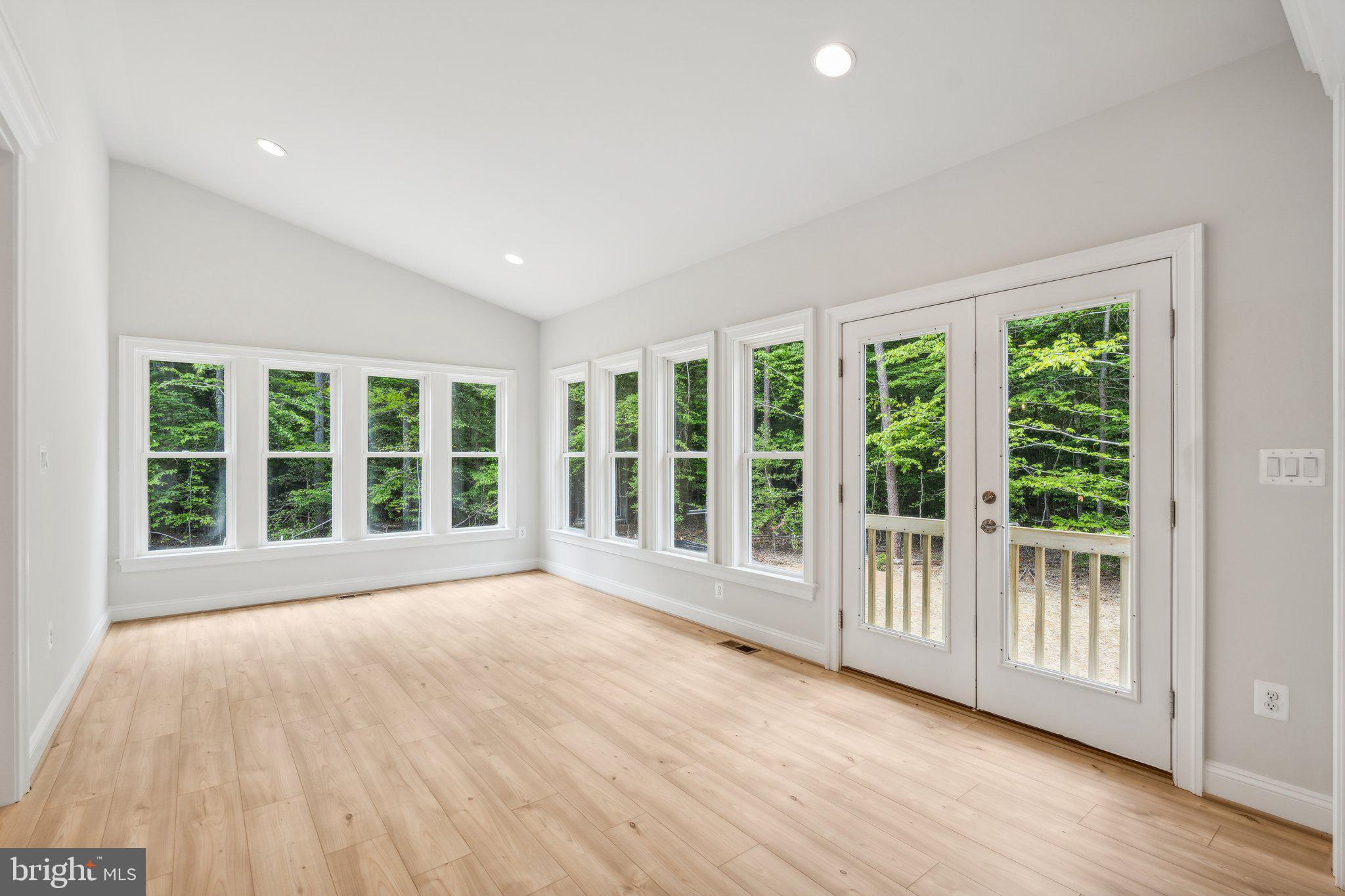 13749 Orlando Road Nokesville, VA 20181 - Photo 37 of 42 a view of an empty room with wooden floor and a window