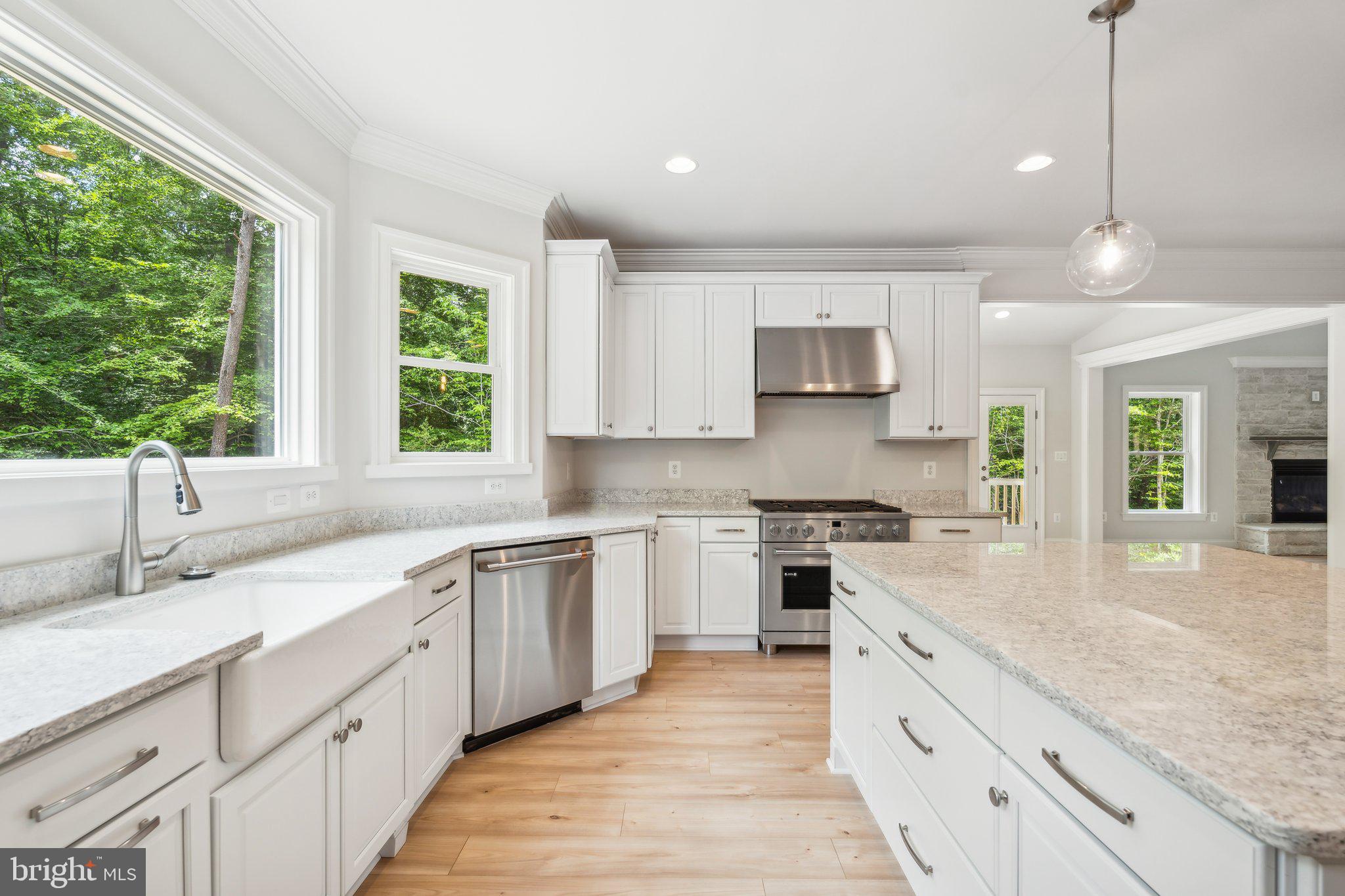 13749 Orlando Road Nokesville, VA 20181 - Photo 41 of 42 a kitchen with stainless steel appliances granite countertop a sink stove and cabinets