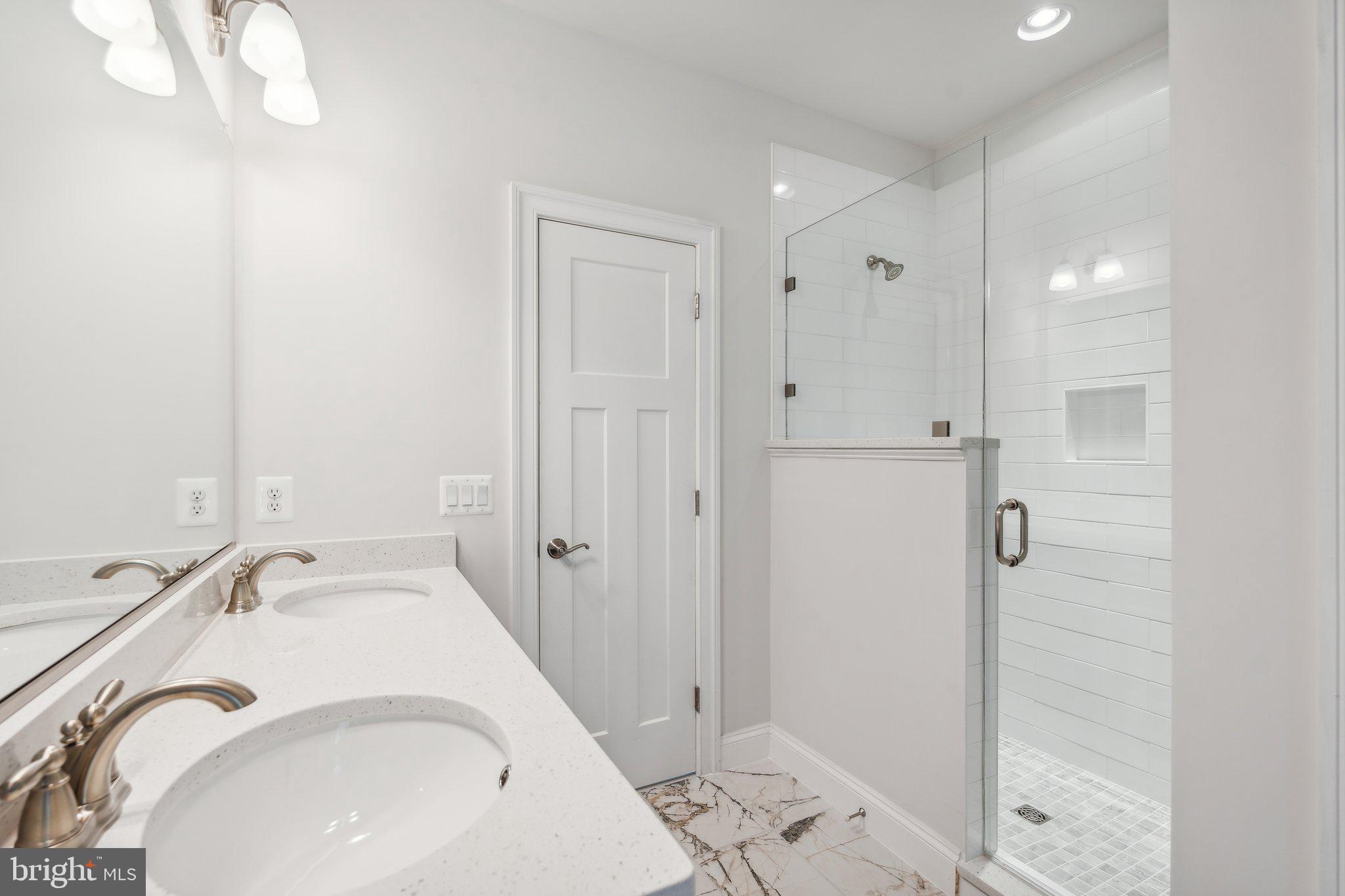 13749 Orlando Road Nokesville, VA 20181 - Photo 6 of 42 a bathroom with a sink and shower