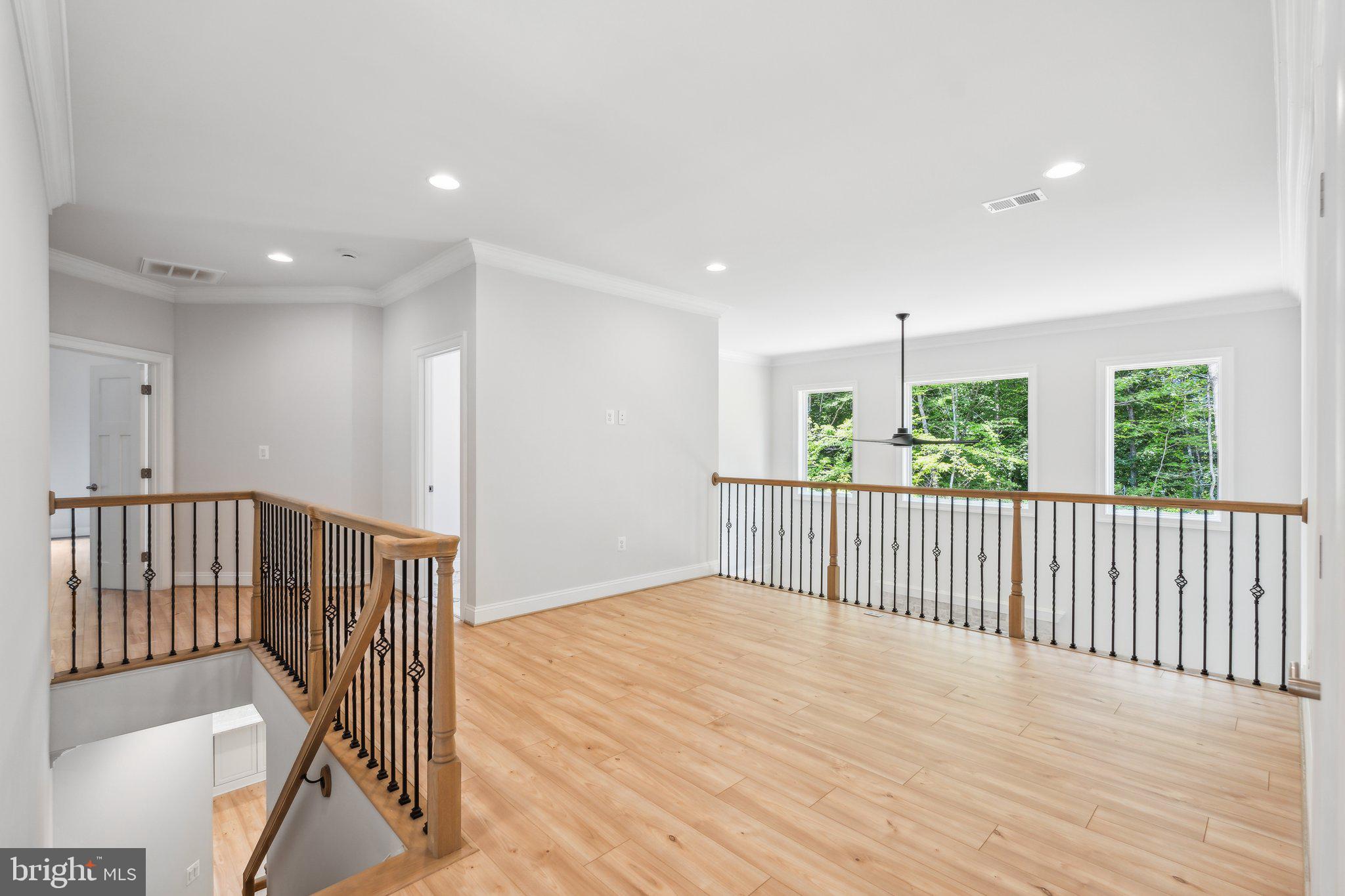 13749 Orlando Road Nokesville, VA 20181 - Photo 9 of 42 a view of a hallway with wooden floor