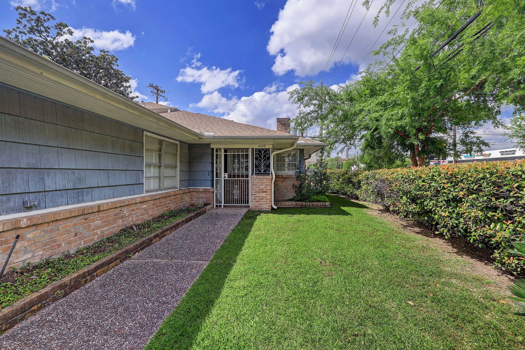 4002 Portsmouth Street Houston, TX 77027 - Photo 2 of 15 a view of a house with backyard and garden