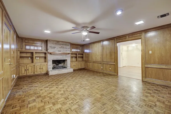 a view of a kitchen with a sink and a refrigerator