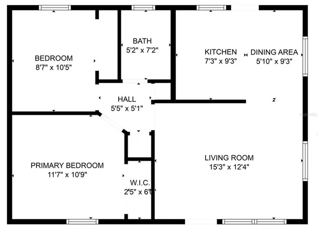 a living room with furniture a table and a potted plant