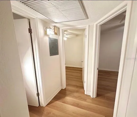 a white kitchen with sink a refrigerator and a stove