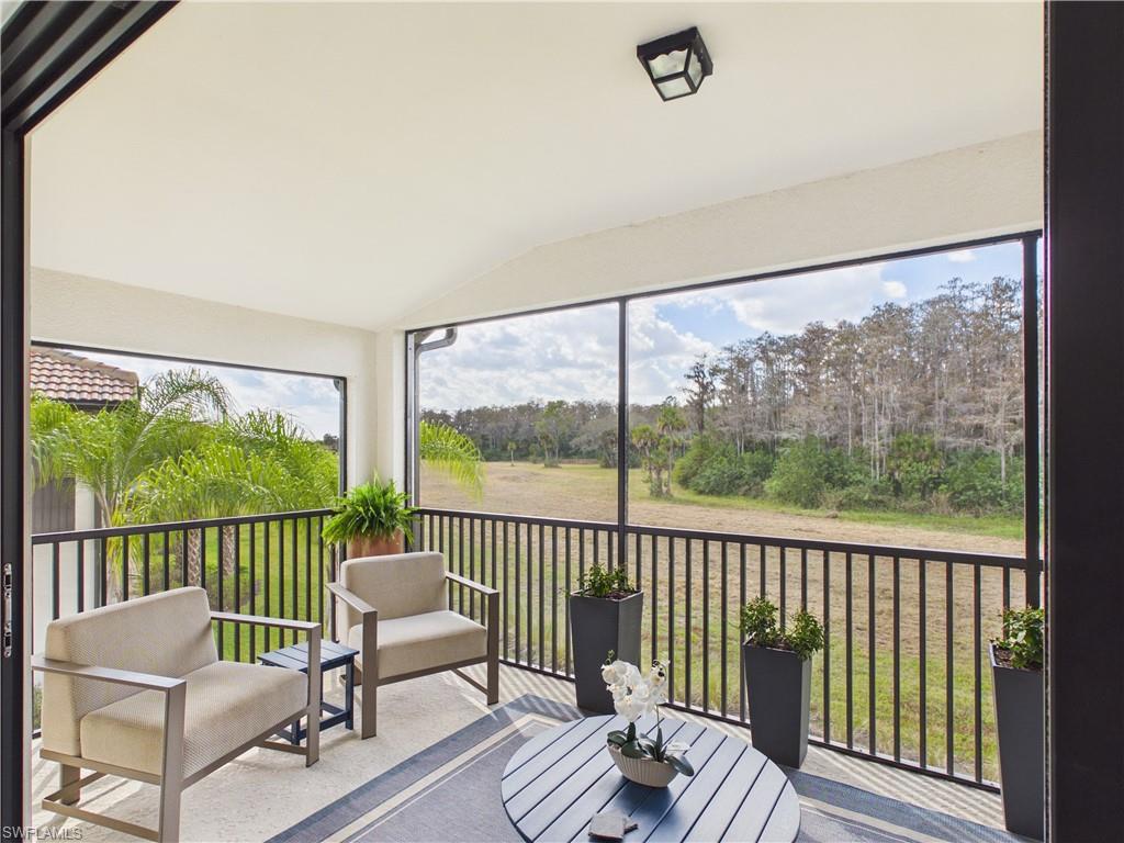 5683 Mayflower Way, Unit 908 Ave Maria, FL 34142 - Photo 19 of 37 Sunroom / solarium featuring lofted ceiling