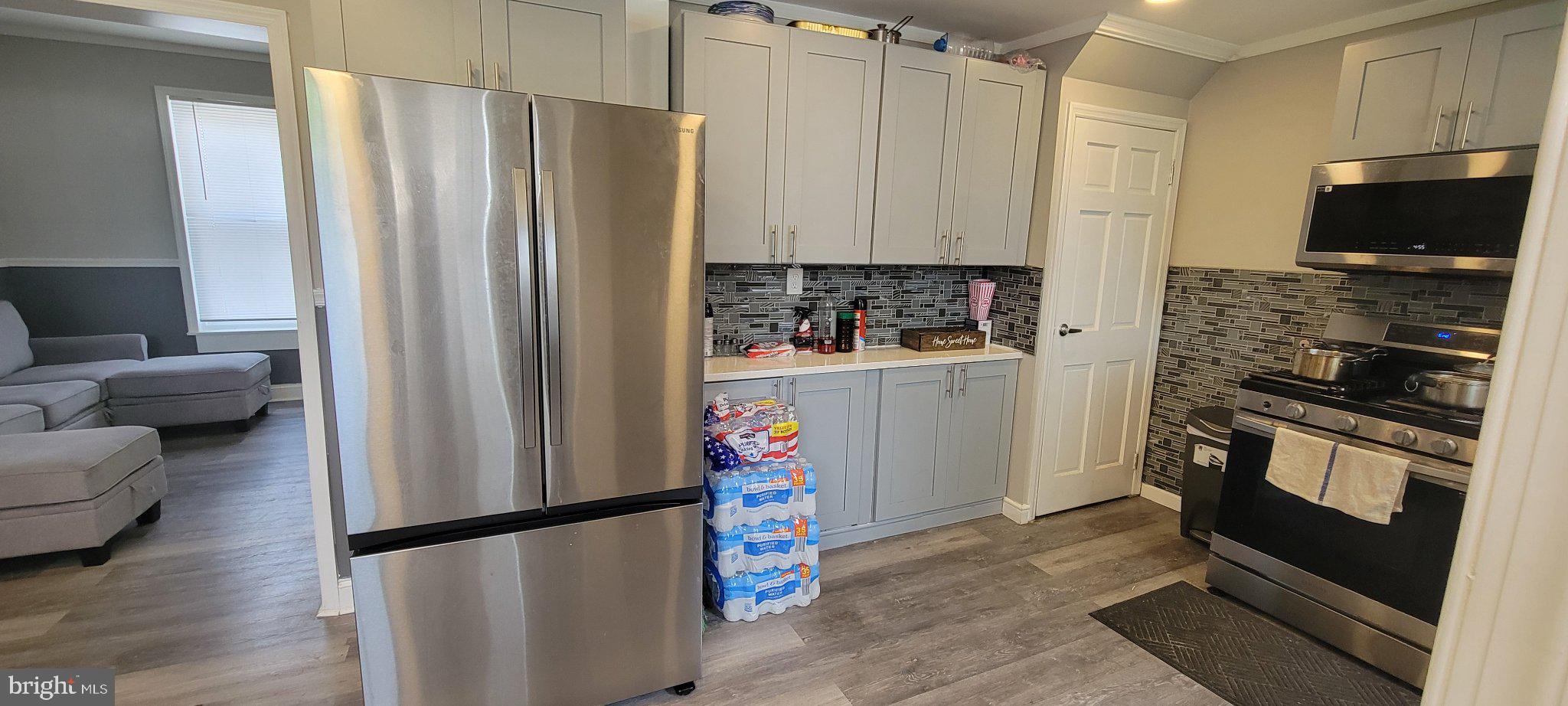 209 North 10th Street Darby, PA 19023 - Photo 7 of 26 Modern kitchen with sleek appliances.