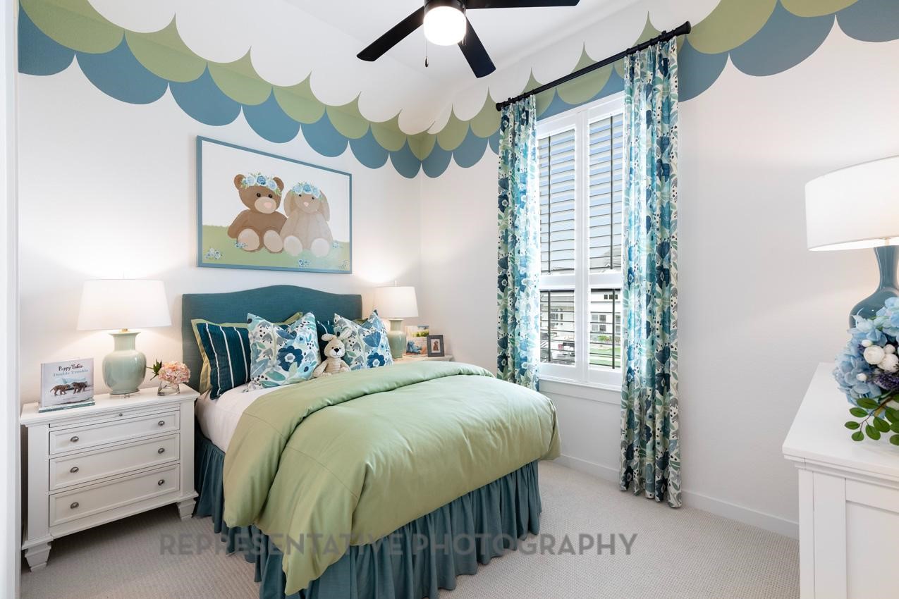 5810 Silver Perch Lane Manvel, TX 77578 - Photo 15 of 18 a bedroom with a bed and a painting on the wall