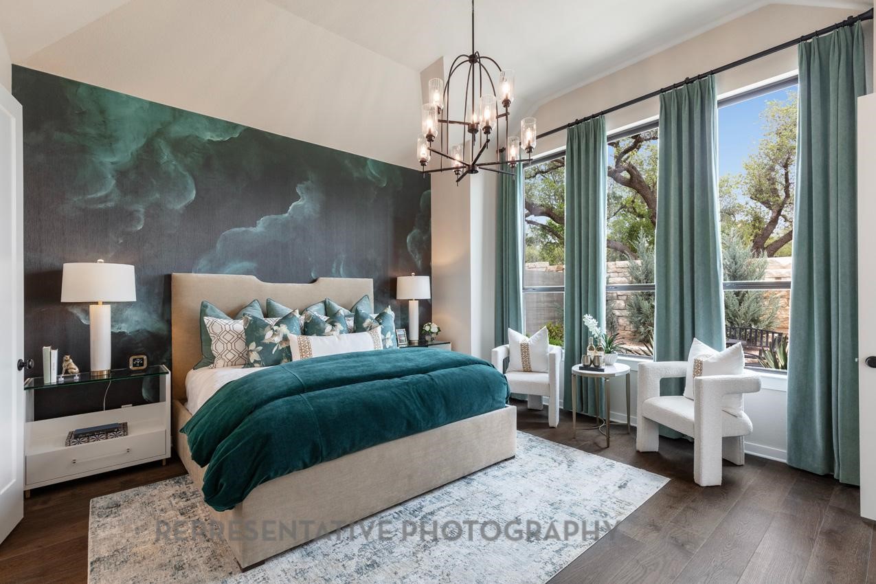 5810 Silver Perch Lane Manvel, TX 77578 - Photo 8 of 18 a bedroom with a large bed and a chandelier