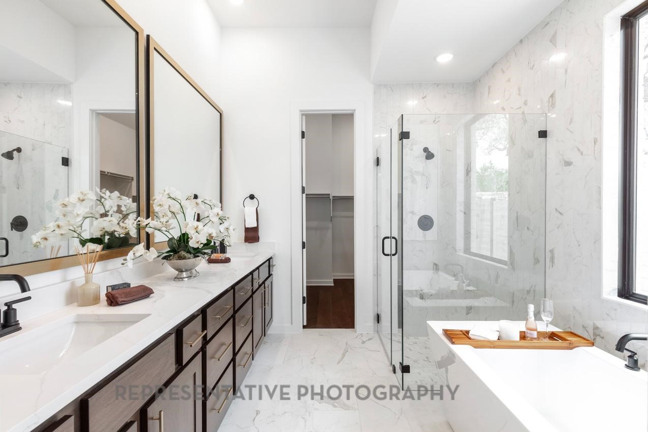 5810 Silver Perch Lane Manvel, TX 77578 - Photo 9 of 18 a bathroom with a sink double vanity granite tub shower and a mirror