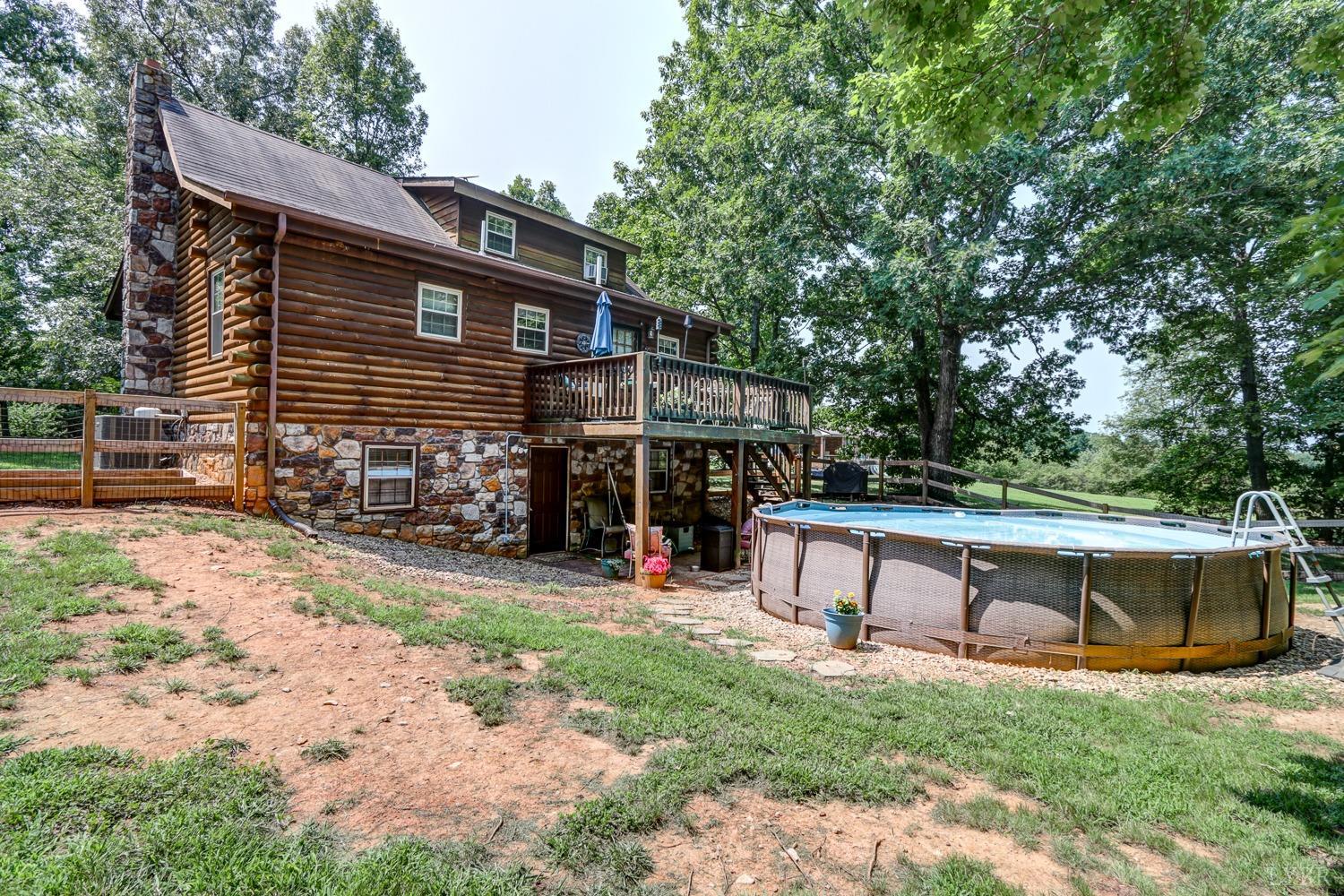 699 Gladys Road Gladys, VA 24554 - Photo 13 of 47 a view of house with backyard and a slide