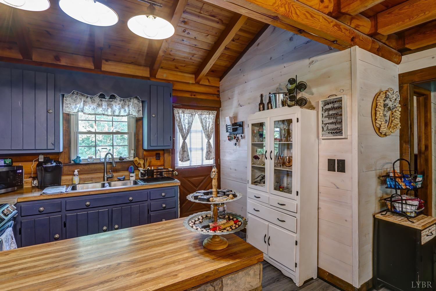 699 Gladys Road Gladys, VA 24554 - Photo 25 of 47 a kitchen with cabinets and window