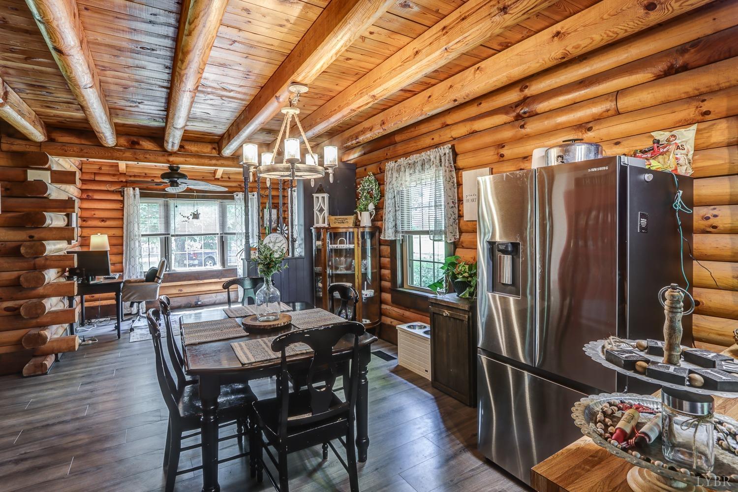 699 Gladys Road Gladys, VA 24554 - Photo 27 of 47 a view of a dining room with furniture window and wooden floor