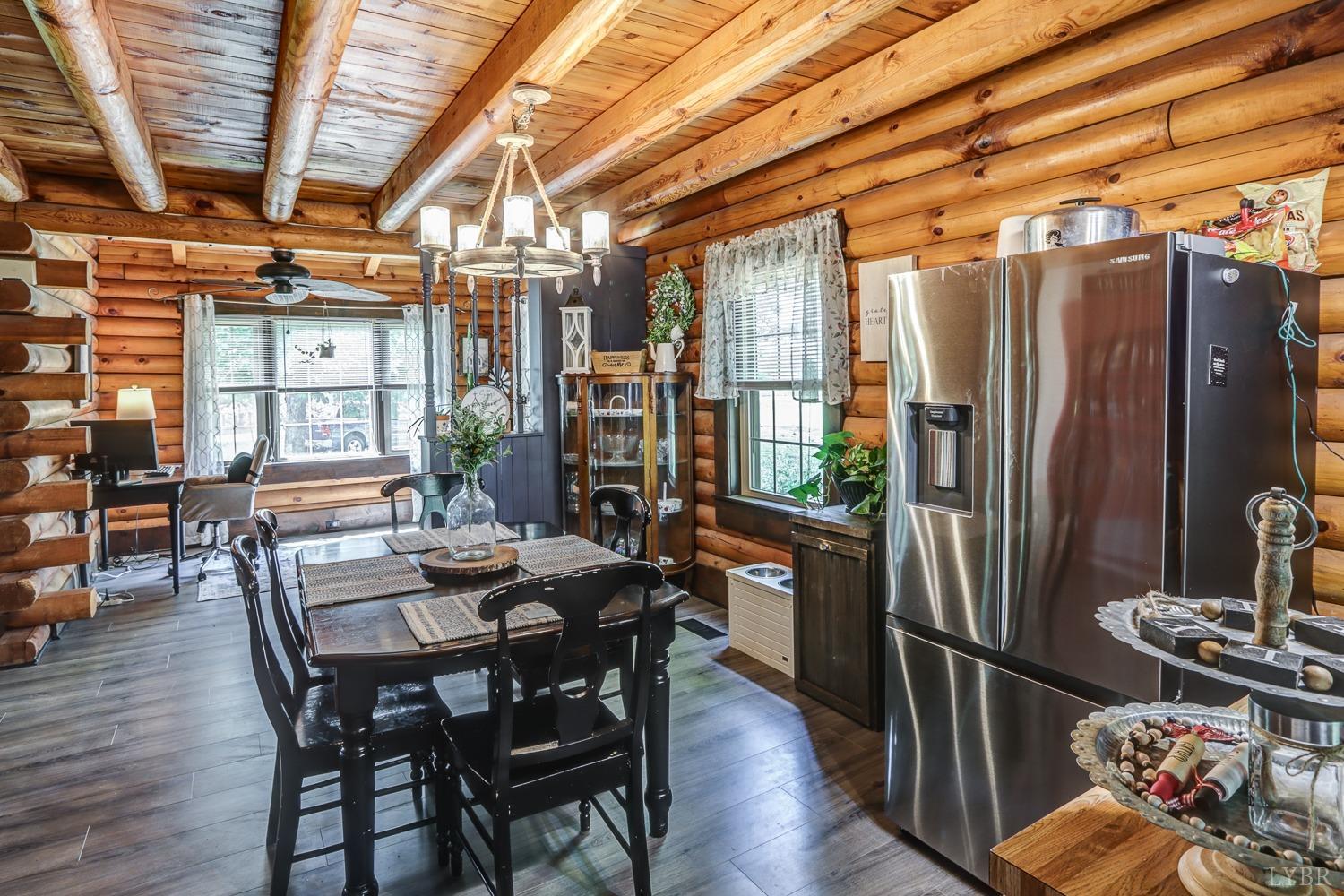699 Gladys Road Gladys, VA 24554 - Photo 28 of 47 a view of a dining room with furniture window and wooden floor
