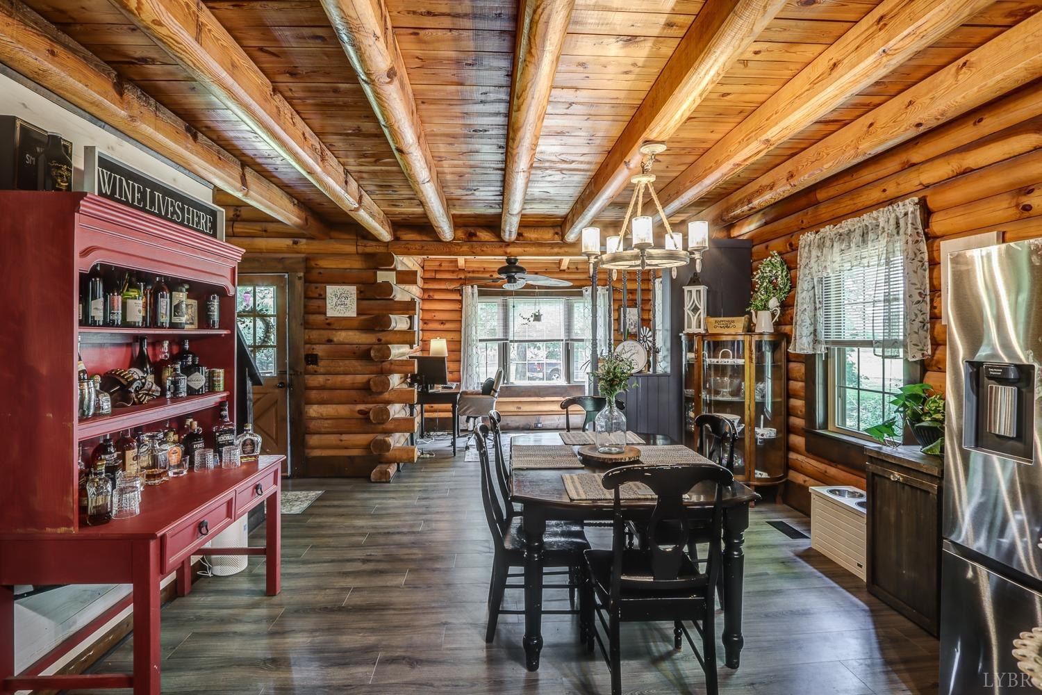 699 Gladys Road Gladys, VA 24554 - Photo 29 of 47 a view of a dining room with furniture window and wooden floor