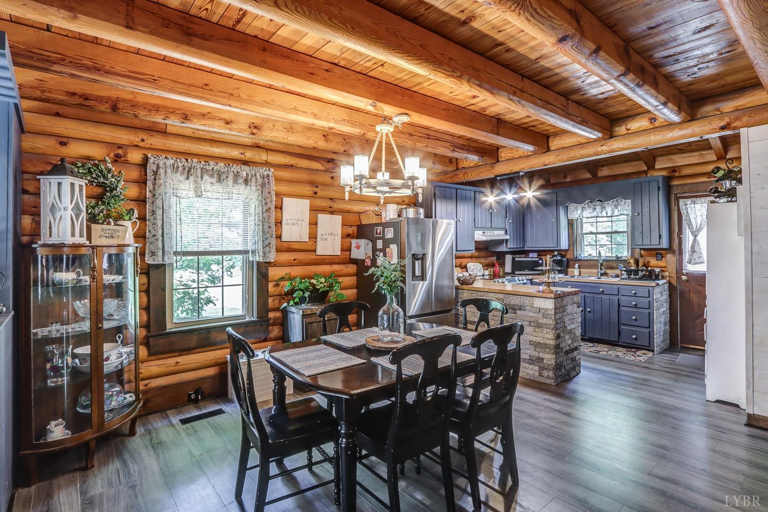 699 Gladys Road Gladys, VA 24554 - Photo 30 of 47 a view of a dining room with furniture window and wooden floor