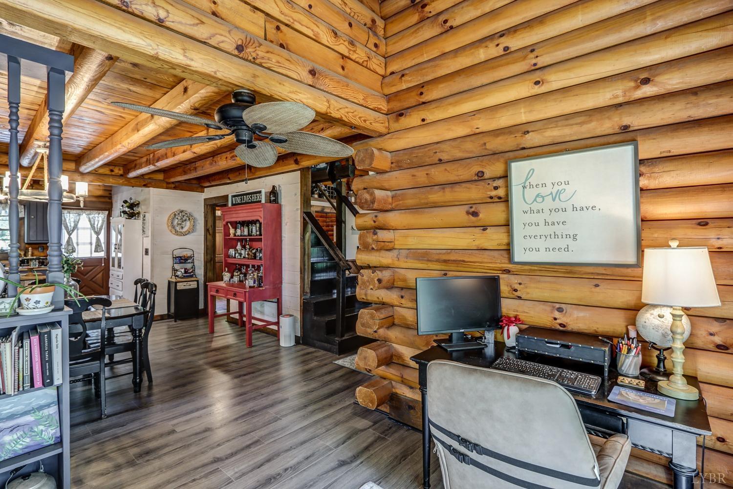 699 Gladys Road Gladys, VA 24554 - Photo 36 of 47 a room with lots of wooden furniture and a window