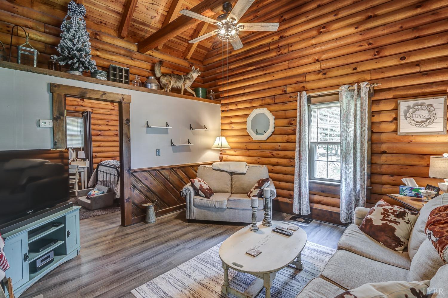 699 Gladys Road Gladys, VA 24554 - Photo 38 of 47 a living room with furniture and a flat screen tv