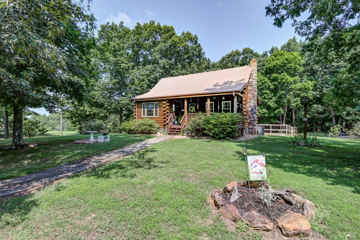 699 Gladys Road Gladys, VA 24554 - Photo 4 of 47 a front view of a house with garden