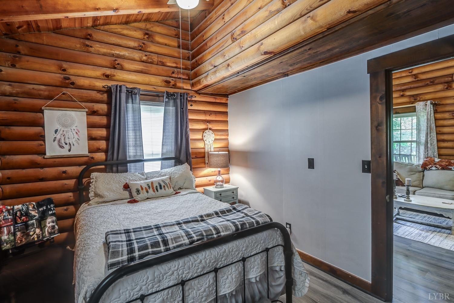 699 Gladys Road Gladys, VA 24554 - Photo 42 of 47 a bedroom with a bed next to a window
