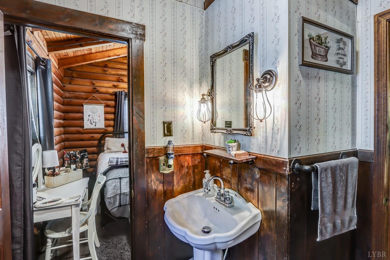 699 Gladys Road Gladys, VA 24554 - Photo 44 of 47 a bathroom with a sink and a mirror