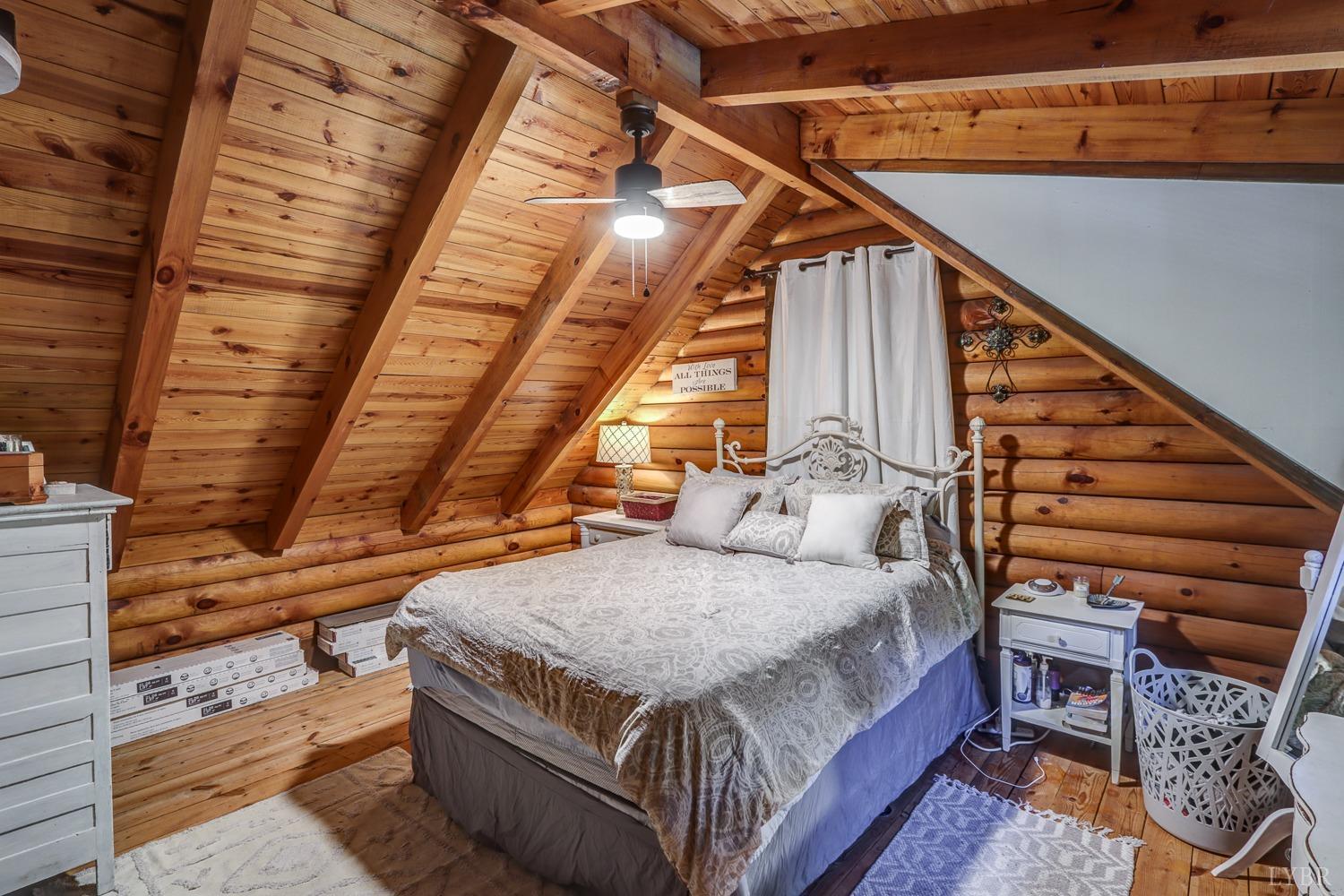 699 Gladys Road Gladys, VA 24554 - Photo 46 of 47 a bedroom with a bed and wooden floor