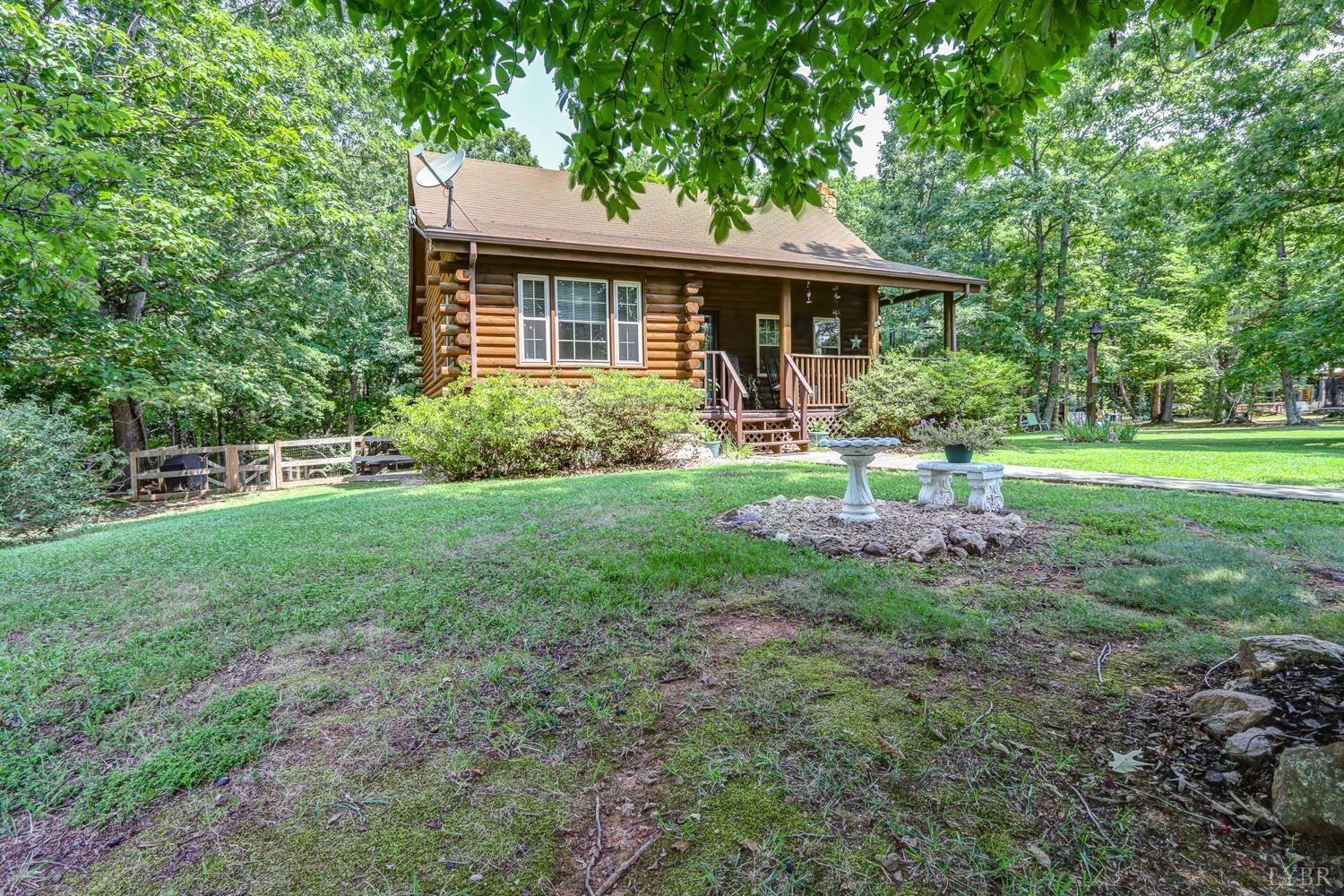 699 Gladys Road Gladys, VA 24554 - Photo 6 of 47 a backyard of a house with table and chairs