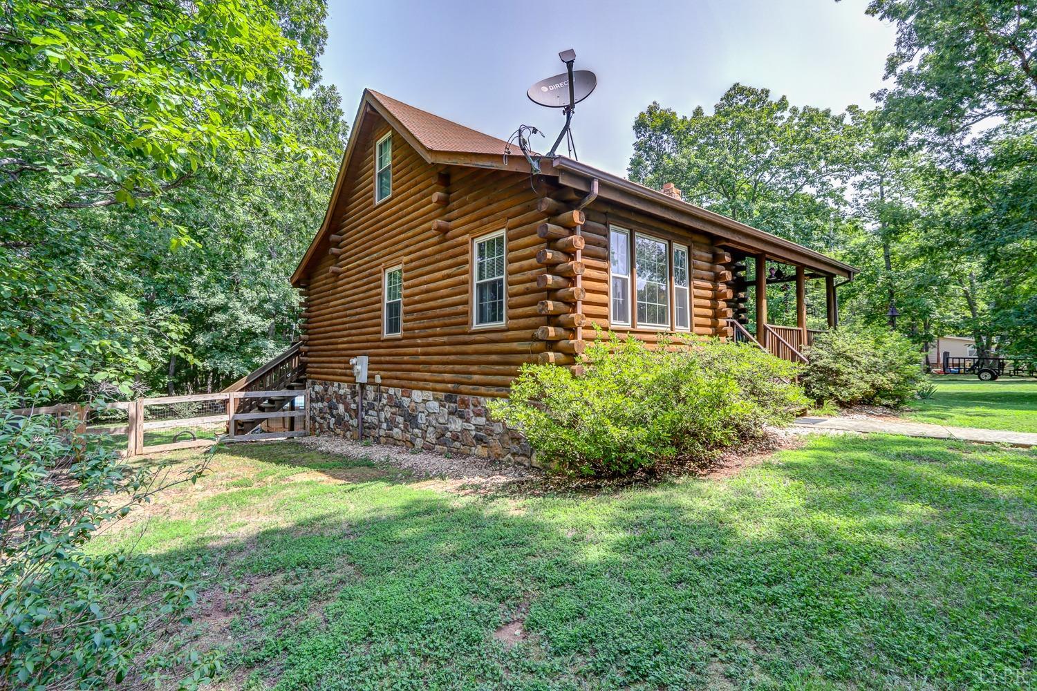 699 Gladys Road Gladys, VA 24554 - Photo 7 of 47 a view of a house with a yard and sitting area