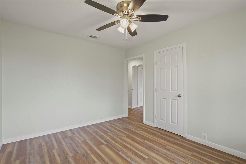 732 Bullock Street Denison, TX 75020 - Photo 20 of 29 wooden floor in an empty room