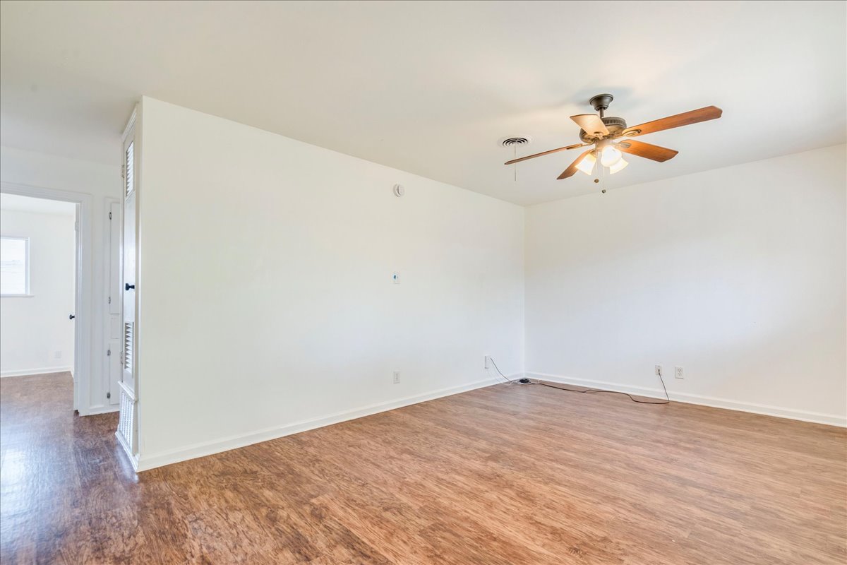 1417 Braes Ridge Drive, Unit B Austin, TX 78723 - Photo 6 of 22 wooden floor in an empty room