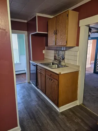 a kitchen with stainless steel appliances granite countertop a stove a refrigerator and a cabinets
