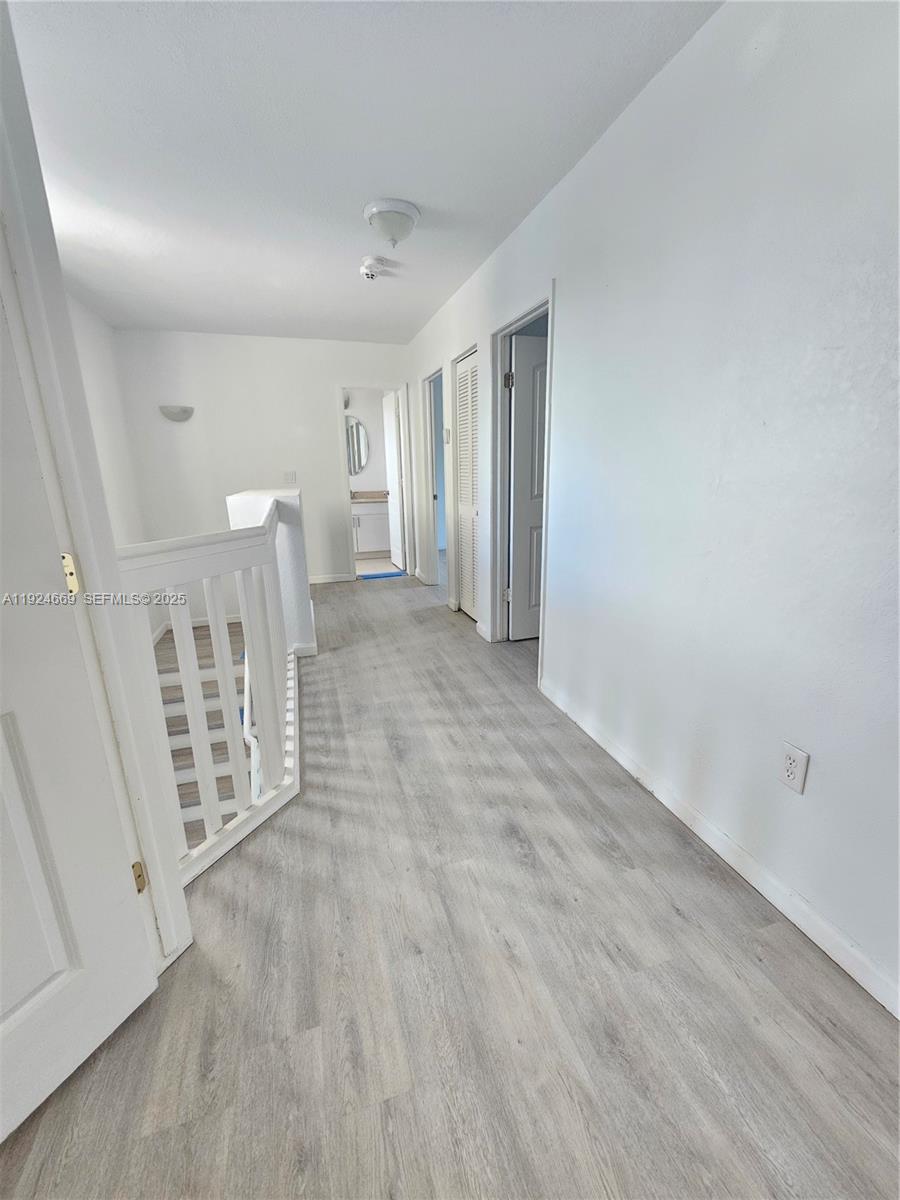 15447 Southwest 151st Street Miami, FL 33196 - Photo 19 of 25 a view of entryway with wooden floor