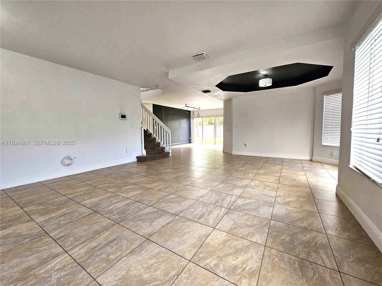 15447 Southwest 151st Street Miami, FL 33196 - Photo 4 of 25 a view of an empty room and window