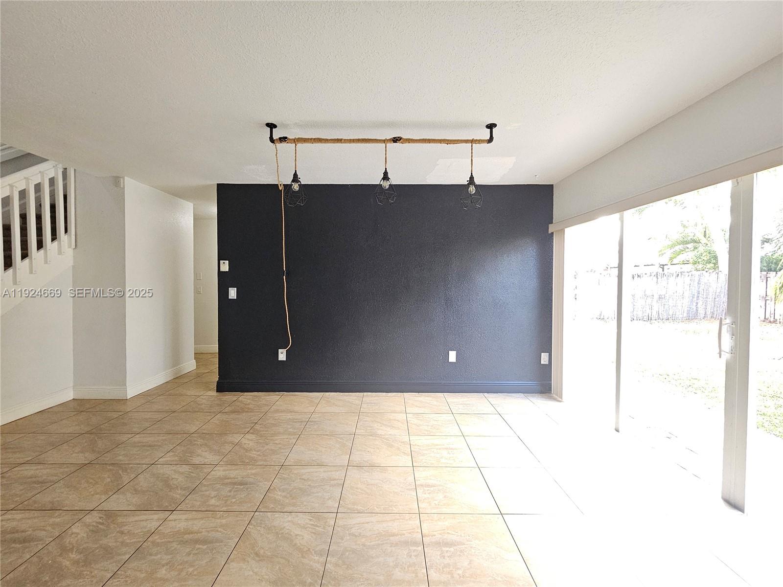 15447 Southwest 151st Street Miami, FL 33196 - Photo 6 of 25 a view of a big room with a window