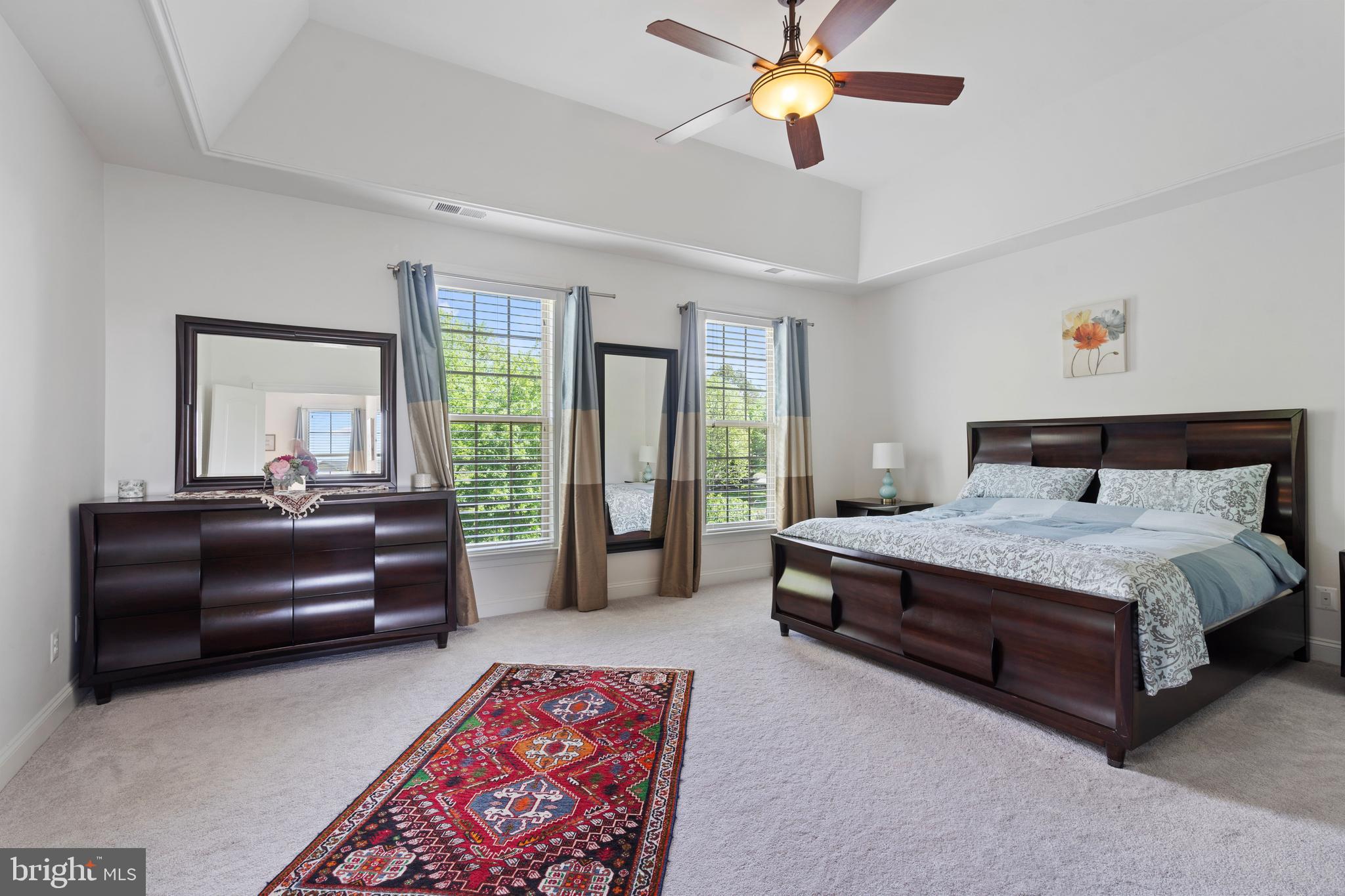 42735 Macauley Place Ashburn, VA 20148 - Photo 18 of 39 a bedroom with a bed and a couch
