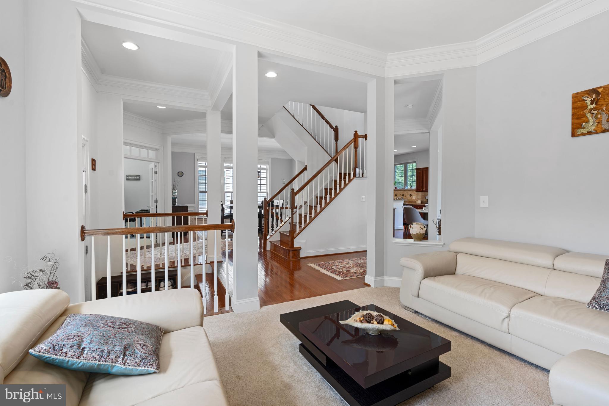 42735 Macauley Place Ashburn, VA 20148 - Photo 6 of 39 a living room with furniture and a table