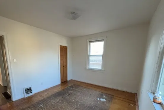 a bathroom with a sink and mirror with bathtub