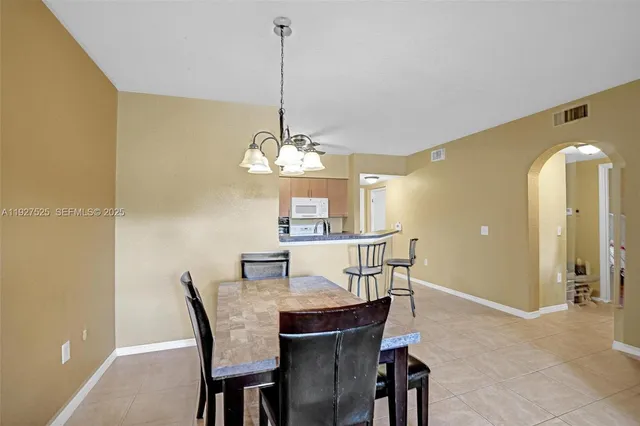 front view of a brick house with a yard