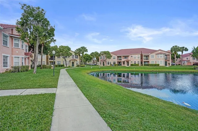 a view of a lake with houses in the back