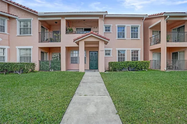 a view of a house with a swimming pool