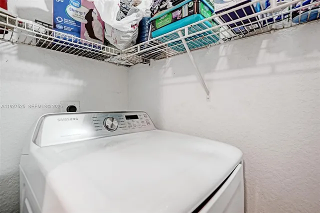 an aerial view of lake residential house with swimming pool and outdoor space