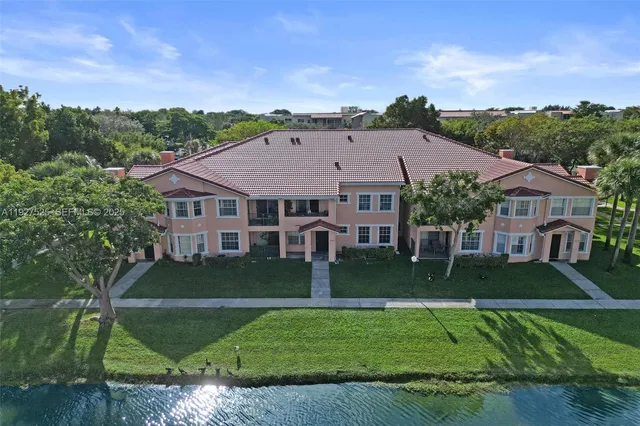 a view of a lake with houses in the back