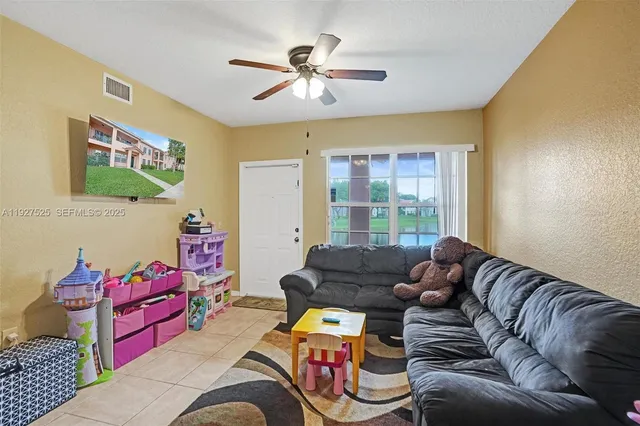 a living room with furniture or couch and a window