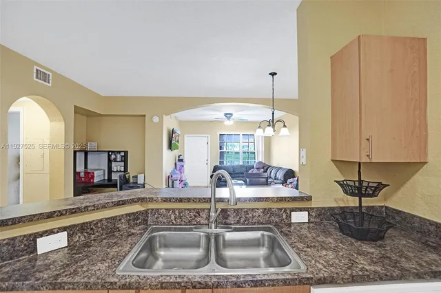 a kitchen with sink and window