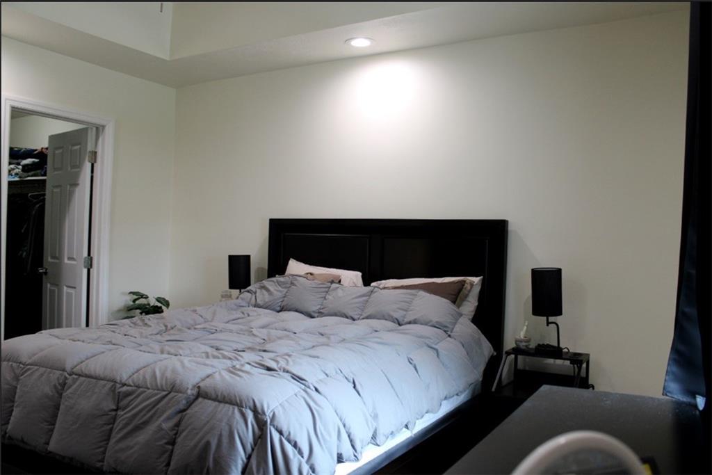 157 East College Street Canonsburg, PA 15317 - Photo 11 of 25 a bedroom with a bed and a lamp