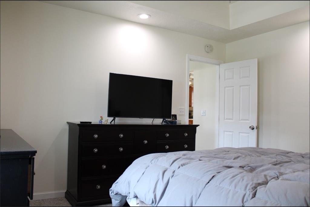 157 East College Street Canonsburg, PA 15317 - Photo 12 of 25 a bedroom with a bed and a flat tv screen on dresser