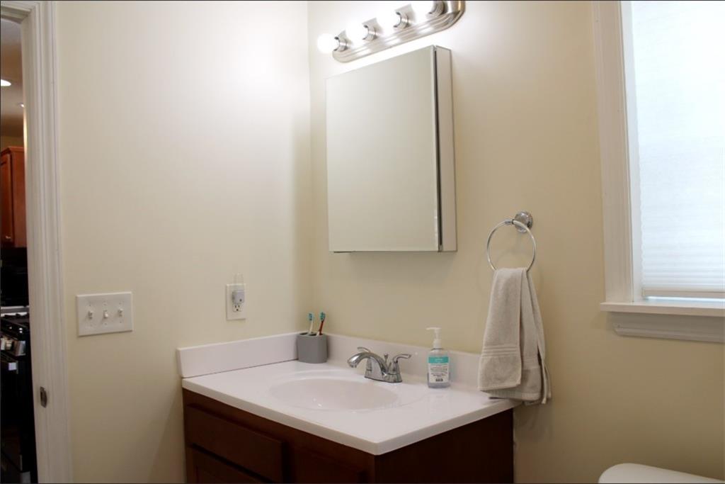 157 East College Street Canonsburg, PA 15317 - Photo 16 of 25 a bathroom with a sink and a mirror