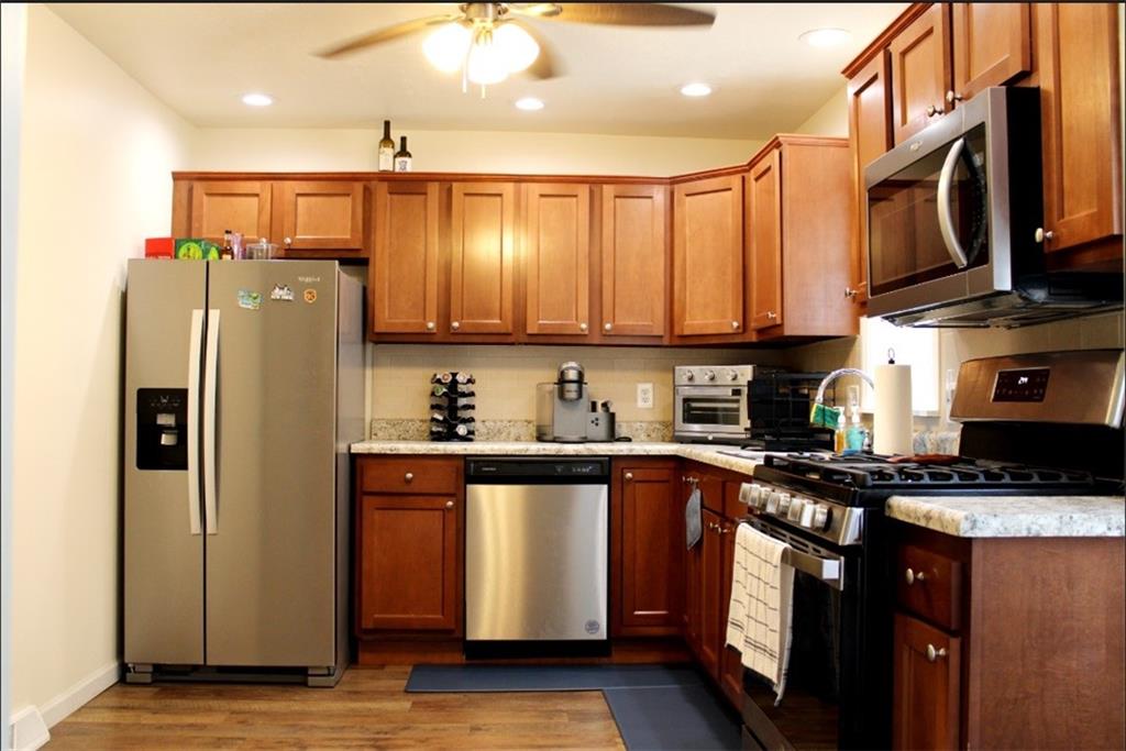 157 East College Street Canonsburg, PA 15317 - Photo 3 of 25 a kitchen with stainless steel appliances granite countertop a refrigerator stove microwave and sink