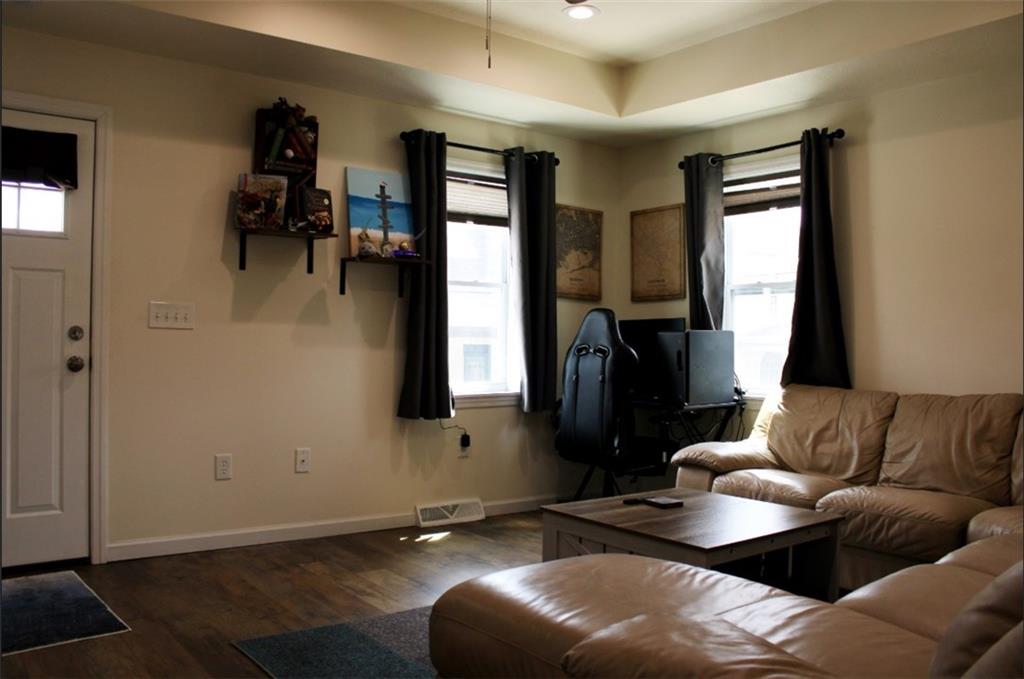 157 East College Street Canonsburg, PA 15317 - Photo 6 of 25 a living room with furniture and a flat screen tv